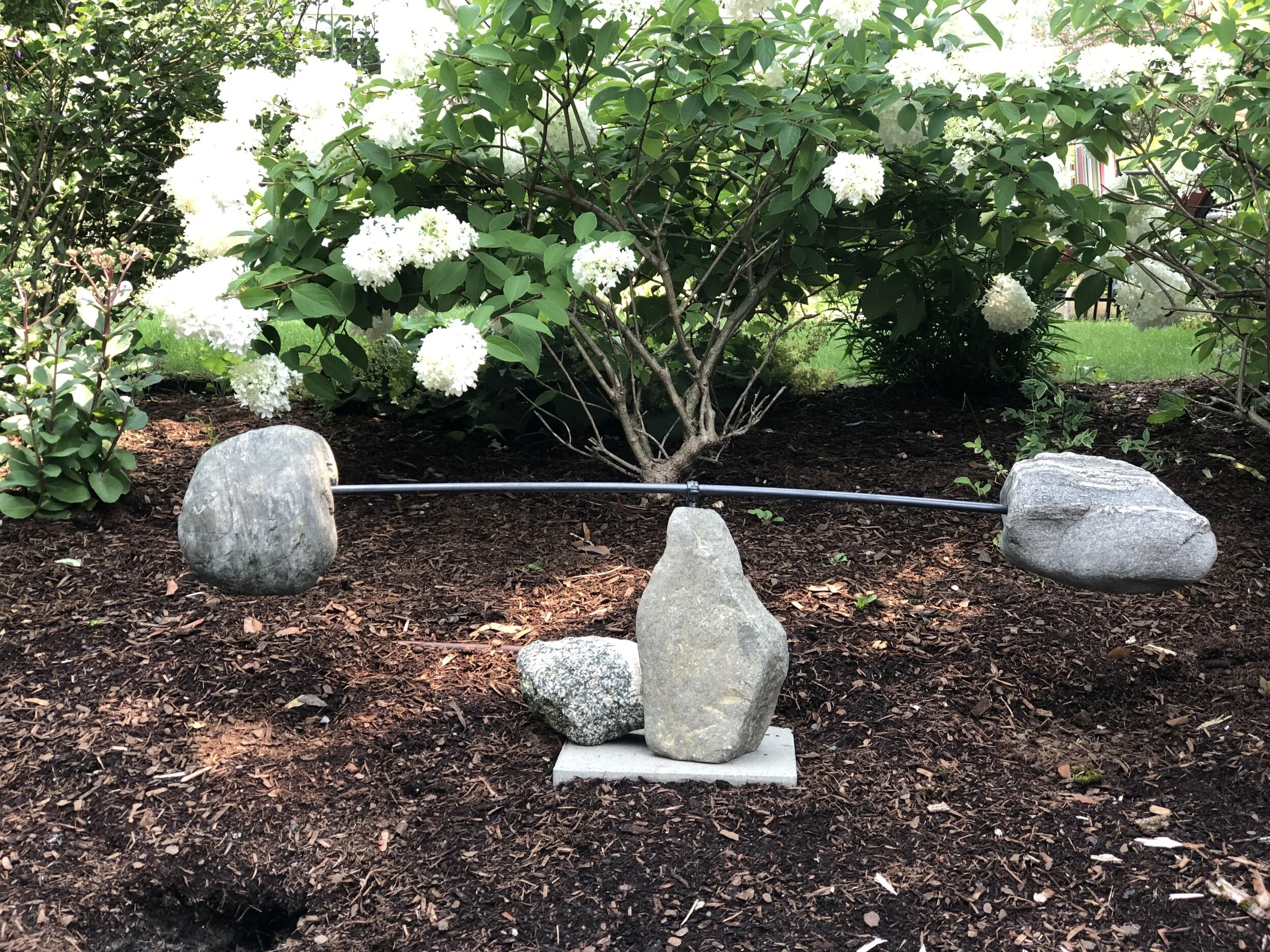 Always looking for it - stone and steel sculpture