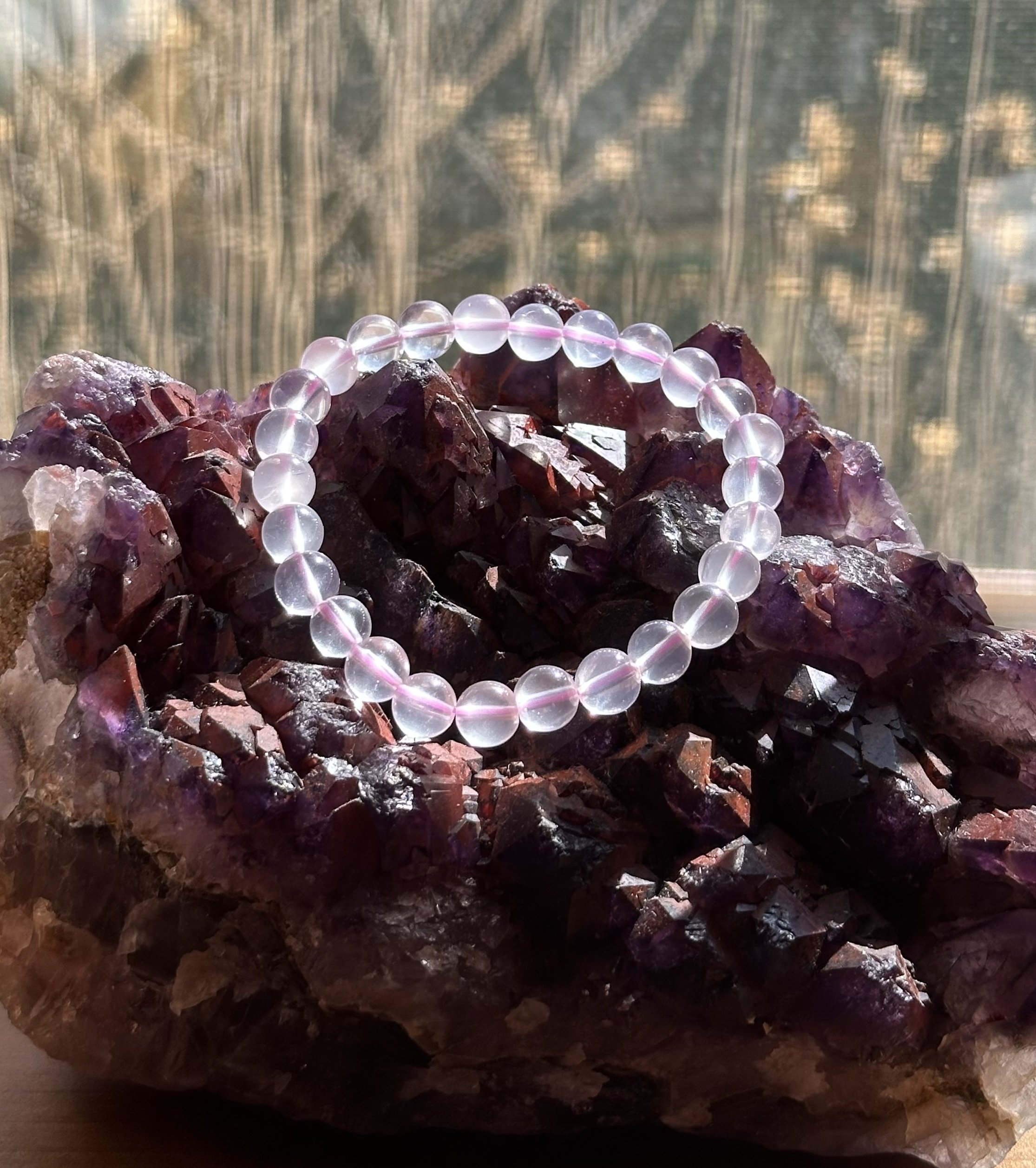 STAR ROSE QUARTZ ON CRYSTAL.jpg