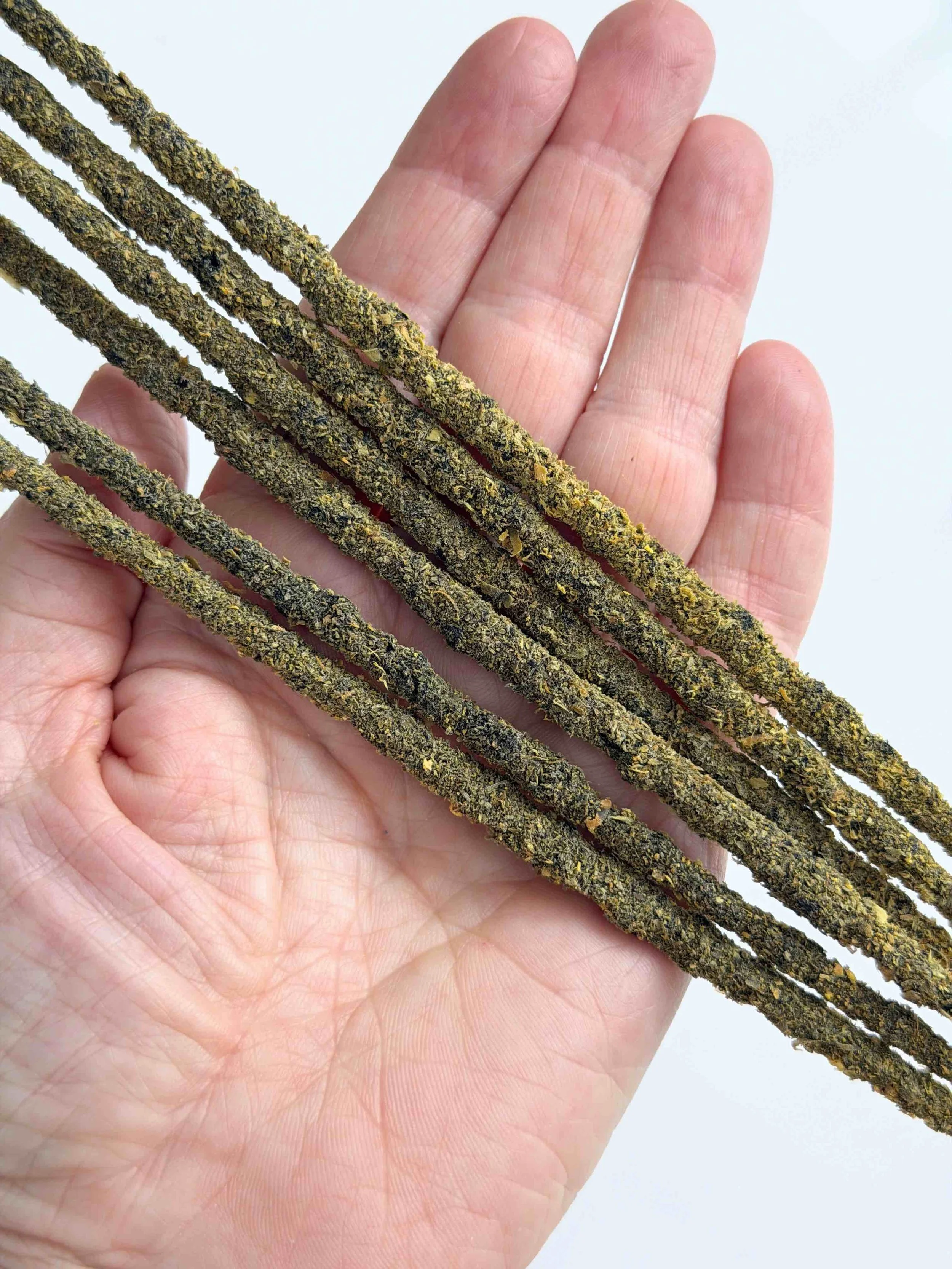 AMBER INCENSE IN HAND.jpeg