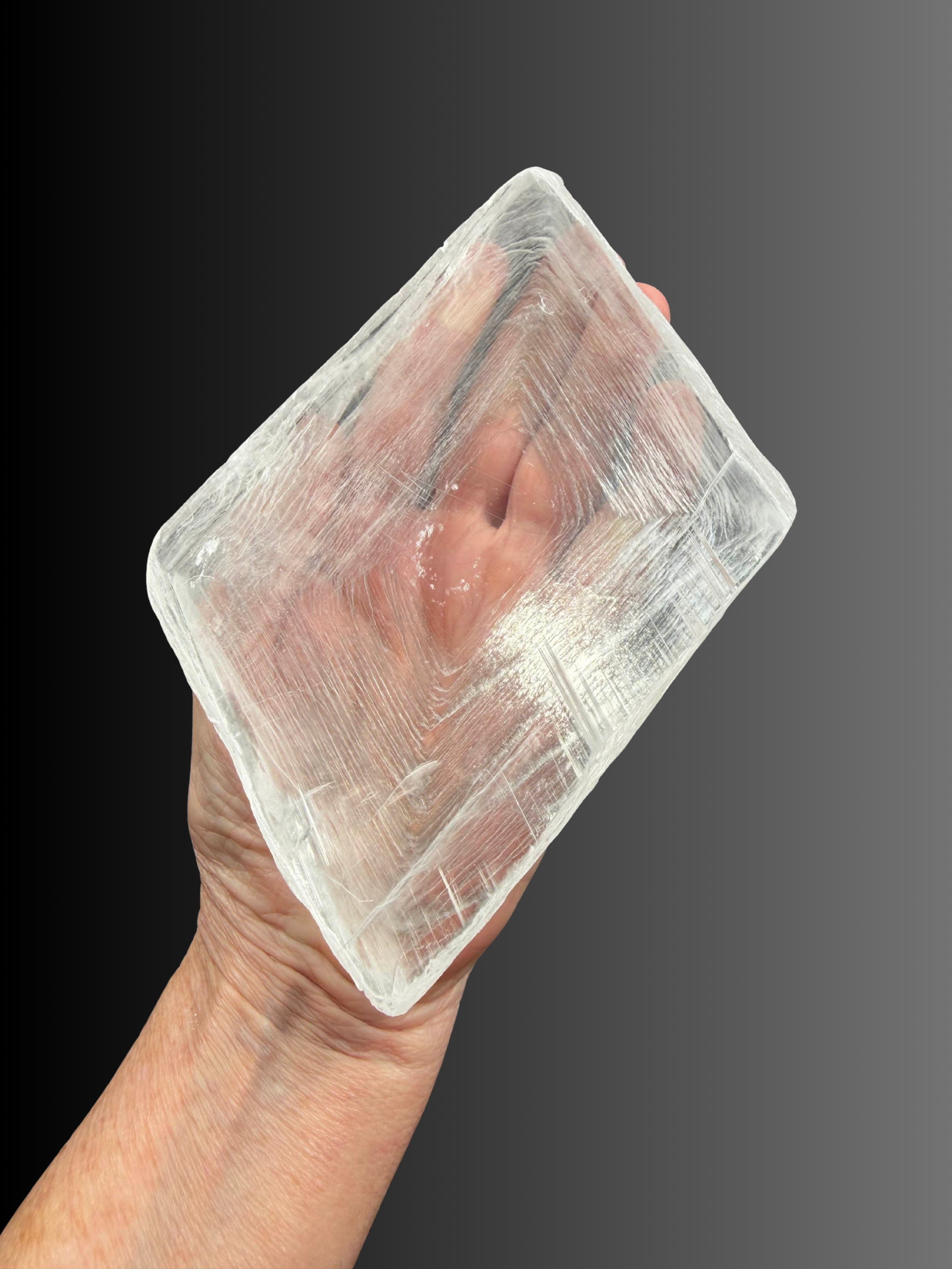 SELENITE FINGERPRINT 32 IN HAND.png