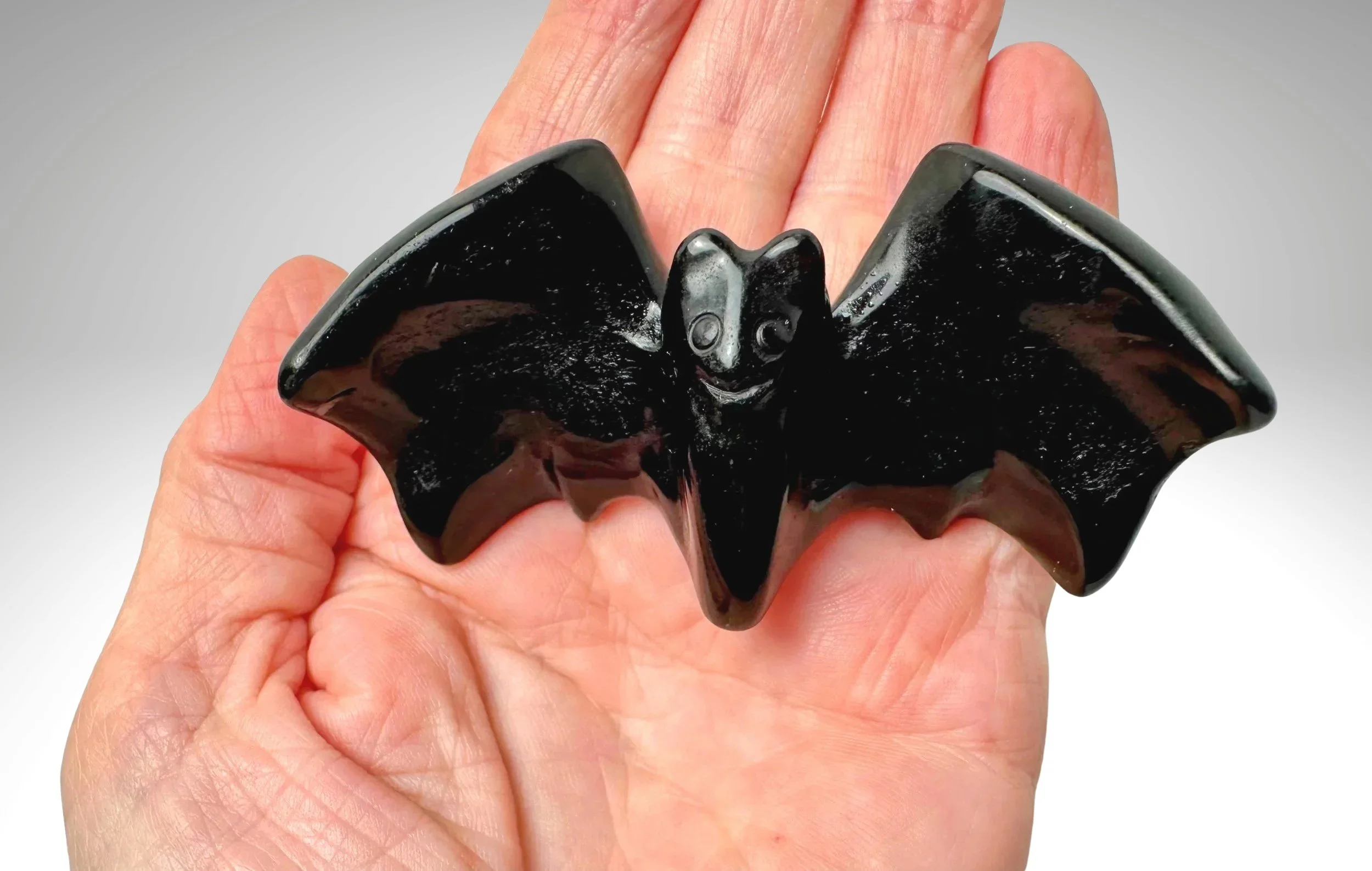 BLACK OBSIDIAN BAT IN HAND.jpg