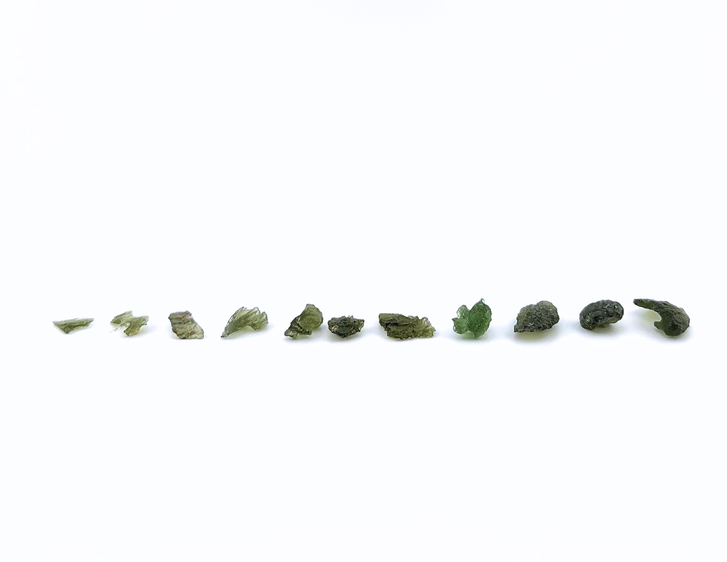 MOLDAVITE LOOSE IN A LINE.png