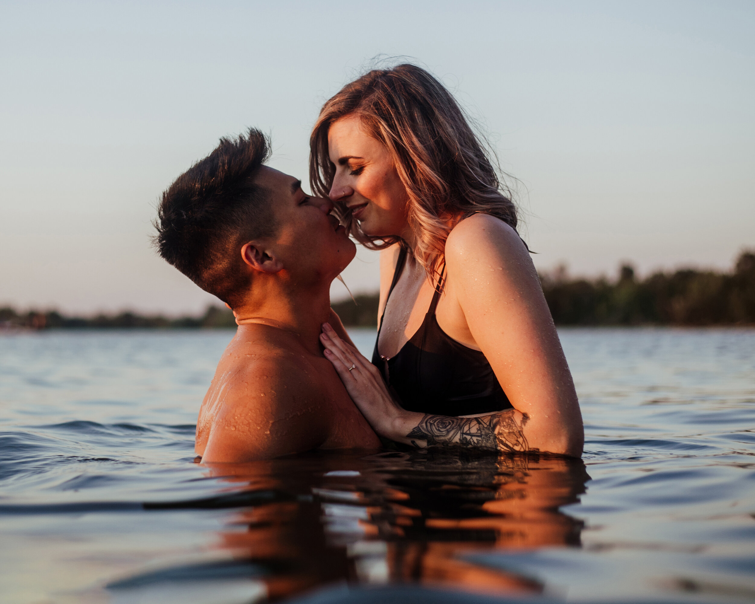 bi racial couple kissing in a lake.jpg