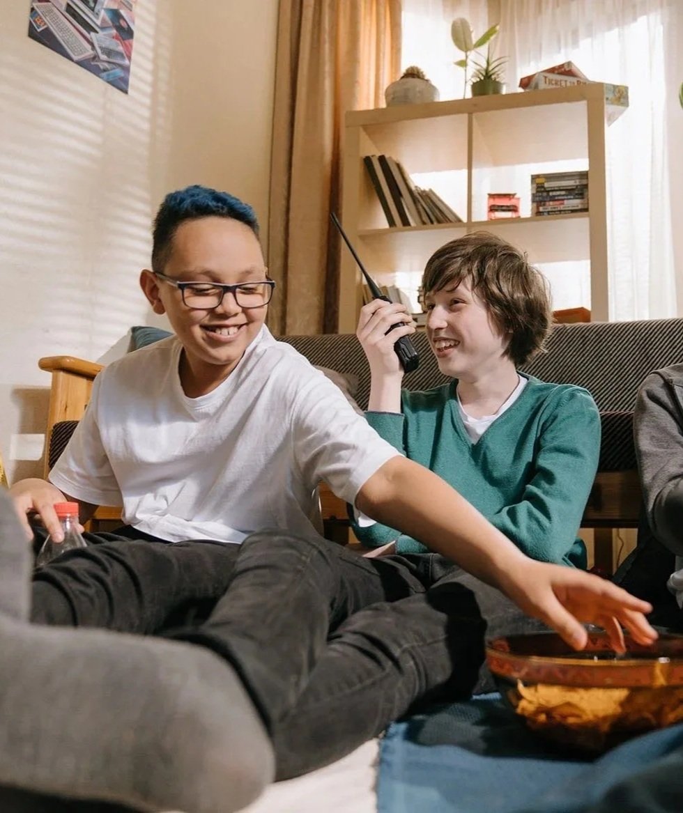 Two young D&D players laughing and hanging out together.