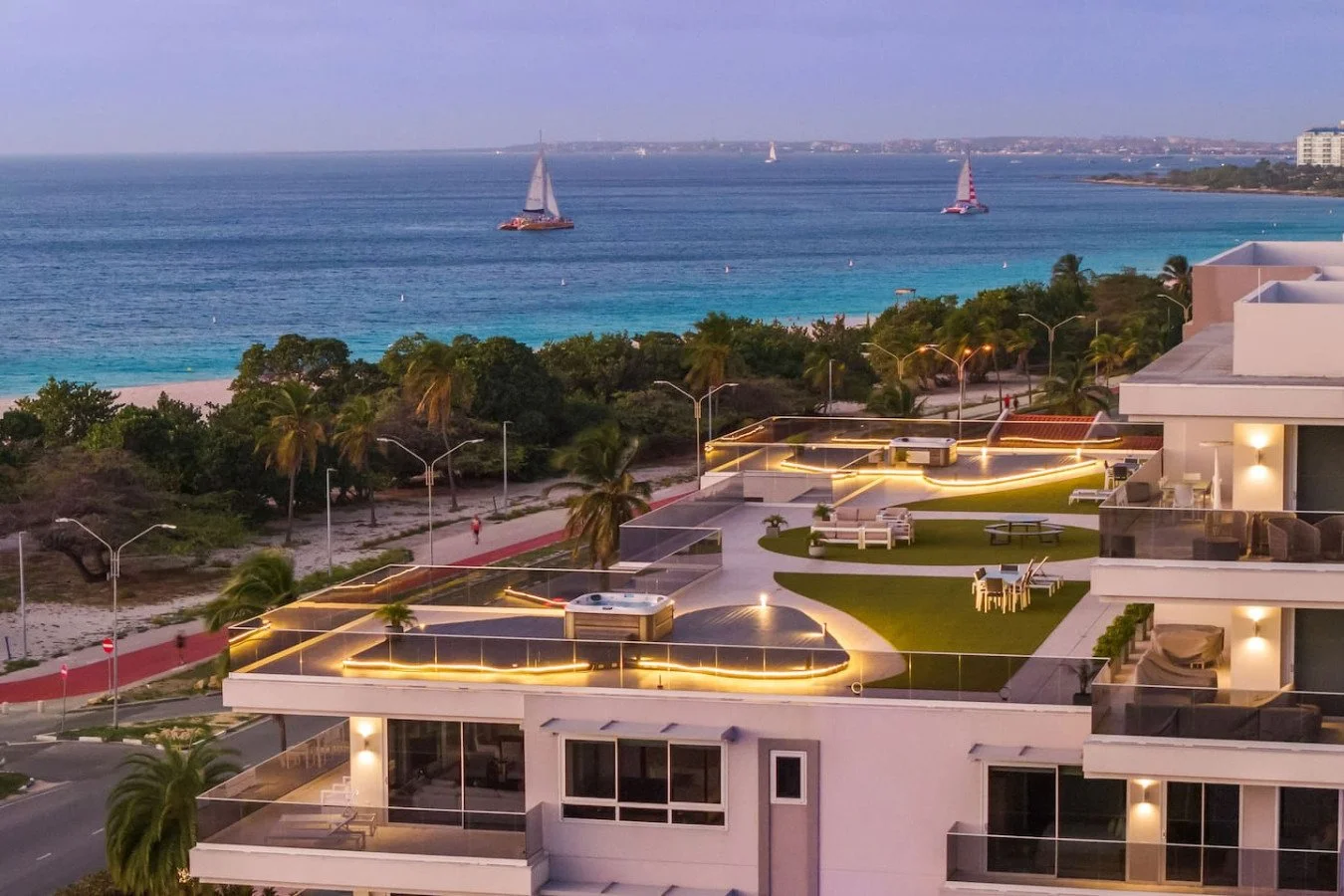 O Condo 24 in Aruba with ocean views, a rooftop terrace, and modern beachfront accommodation.