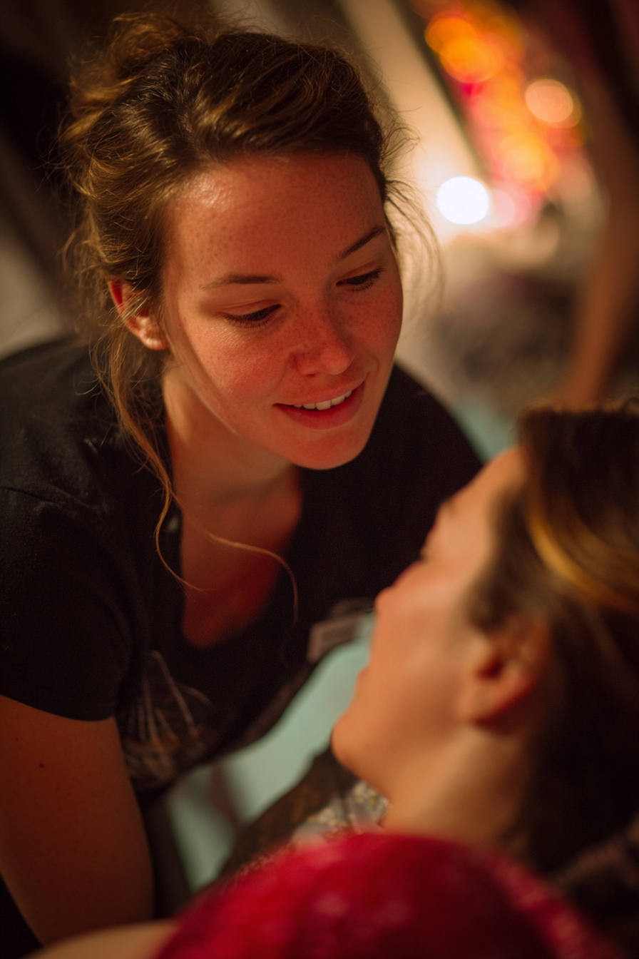 Husband supporting wife through natural hypnobirthing labor