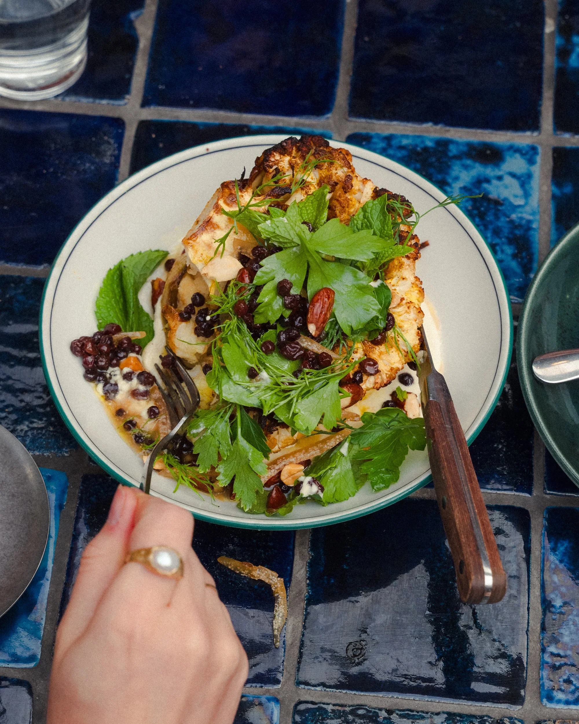 roasted cauliflower, almond tarator, preserved lemon, currants at Teller