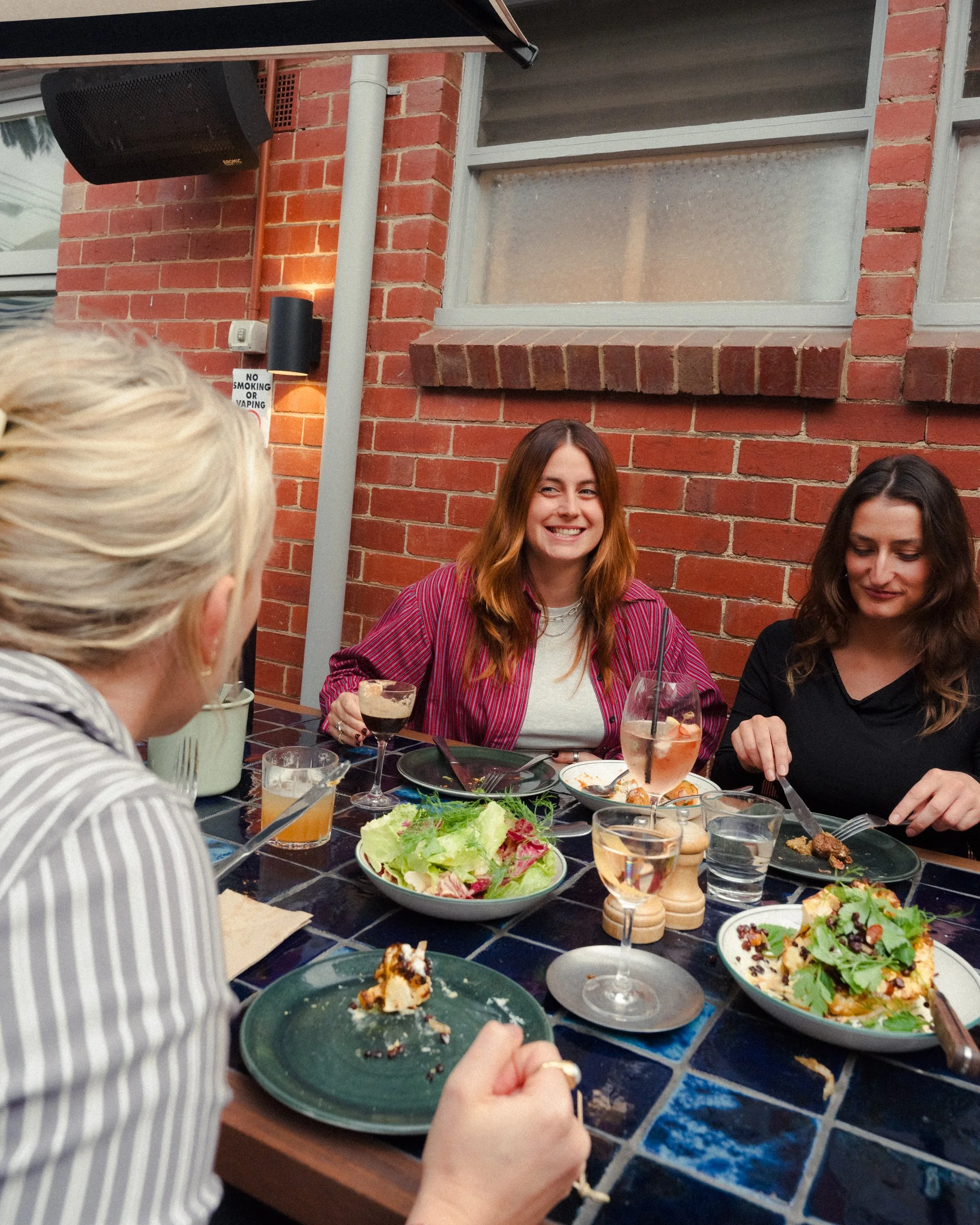 Guests enjoying lunch at Teller laneway outdoor sitting