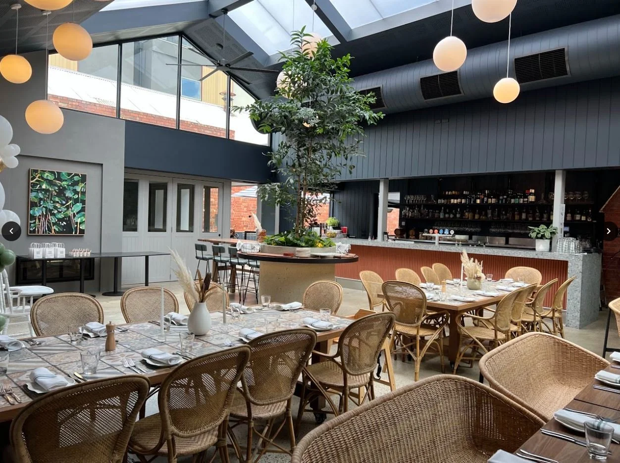 Bright skyline, warm lighting, big spaces perfect for hosting events at Teller