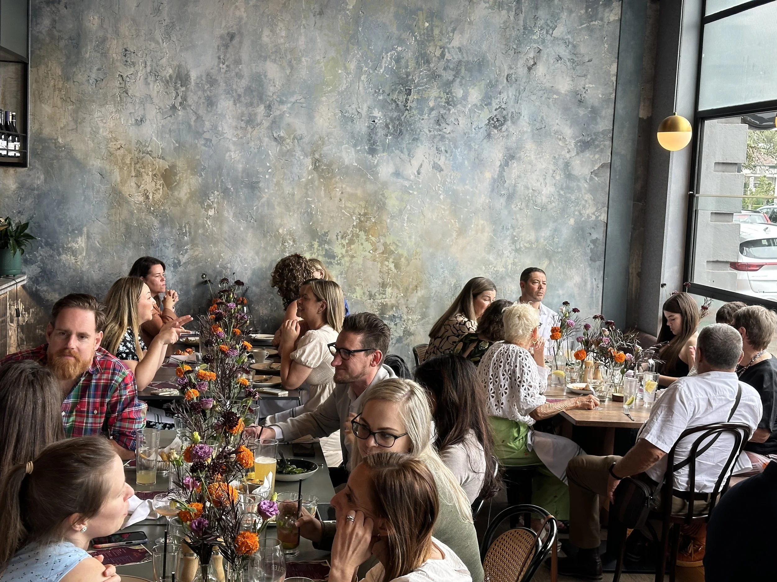 Guests celebrating at Teller's front bar area