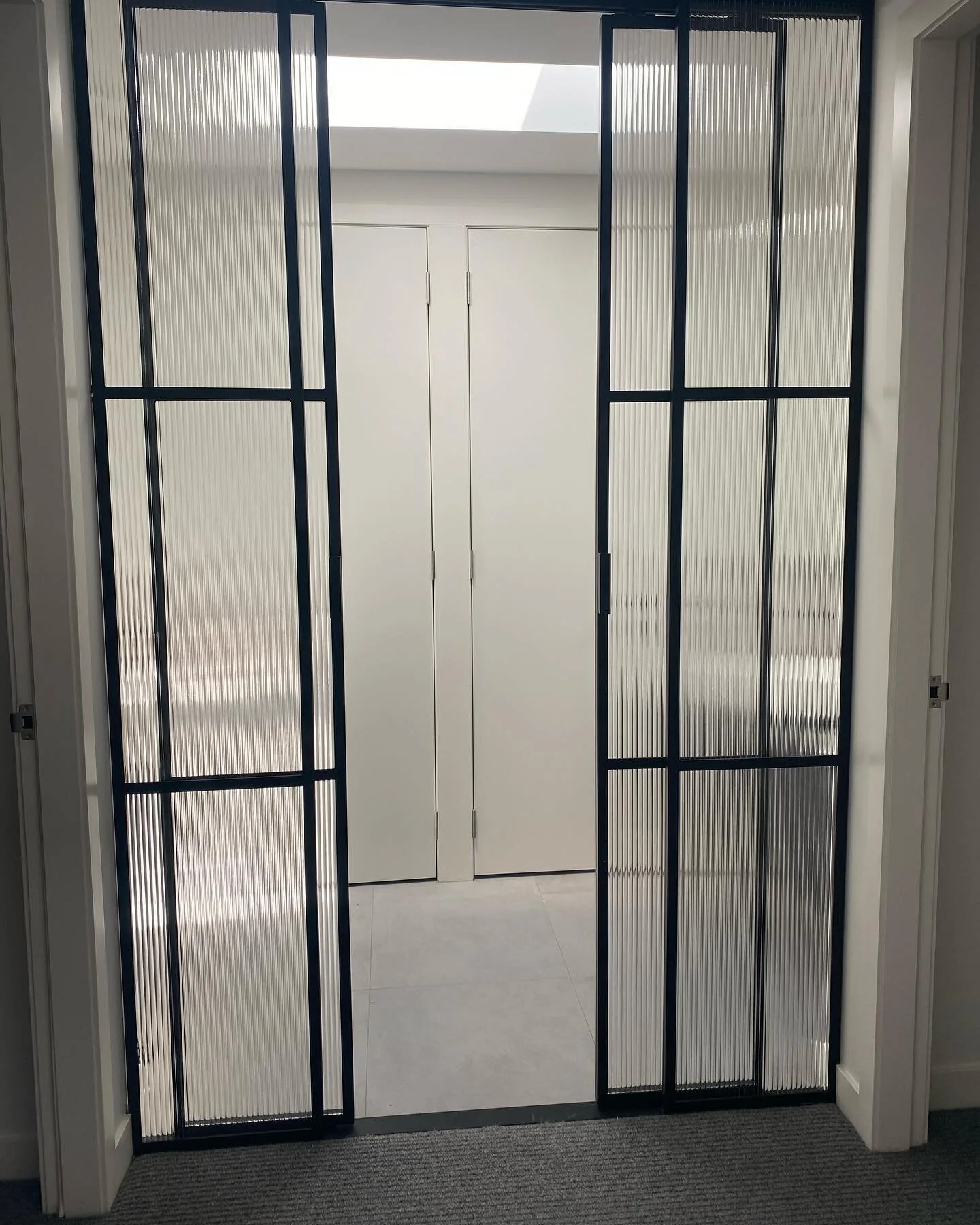 Check out these steel framed Reeded Glass sliding doors! Classy!