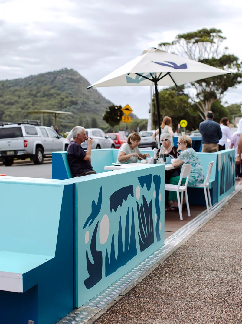 sean thomas bell paints mural on parklets to help community engagement for port stephens council.jpg