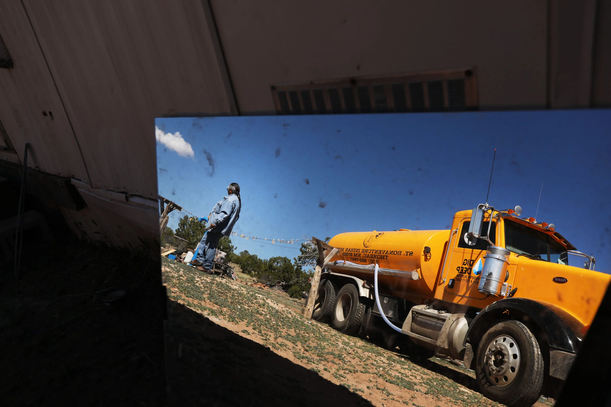Darlene Arviso is reflected in a mirror as she drives a water truck to deliver water to members of the Navajo Nation on June 06, 2019 in Thoreau, New Mexico. (Photo by Spencer Platt/Getty Images, 2019)