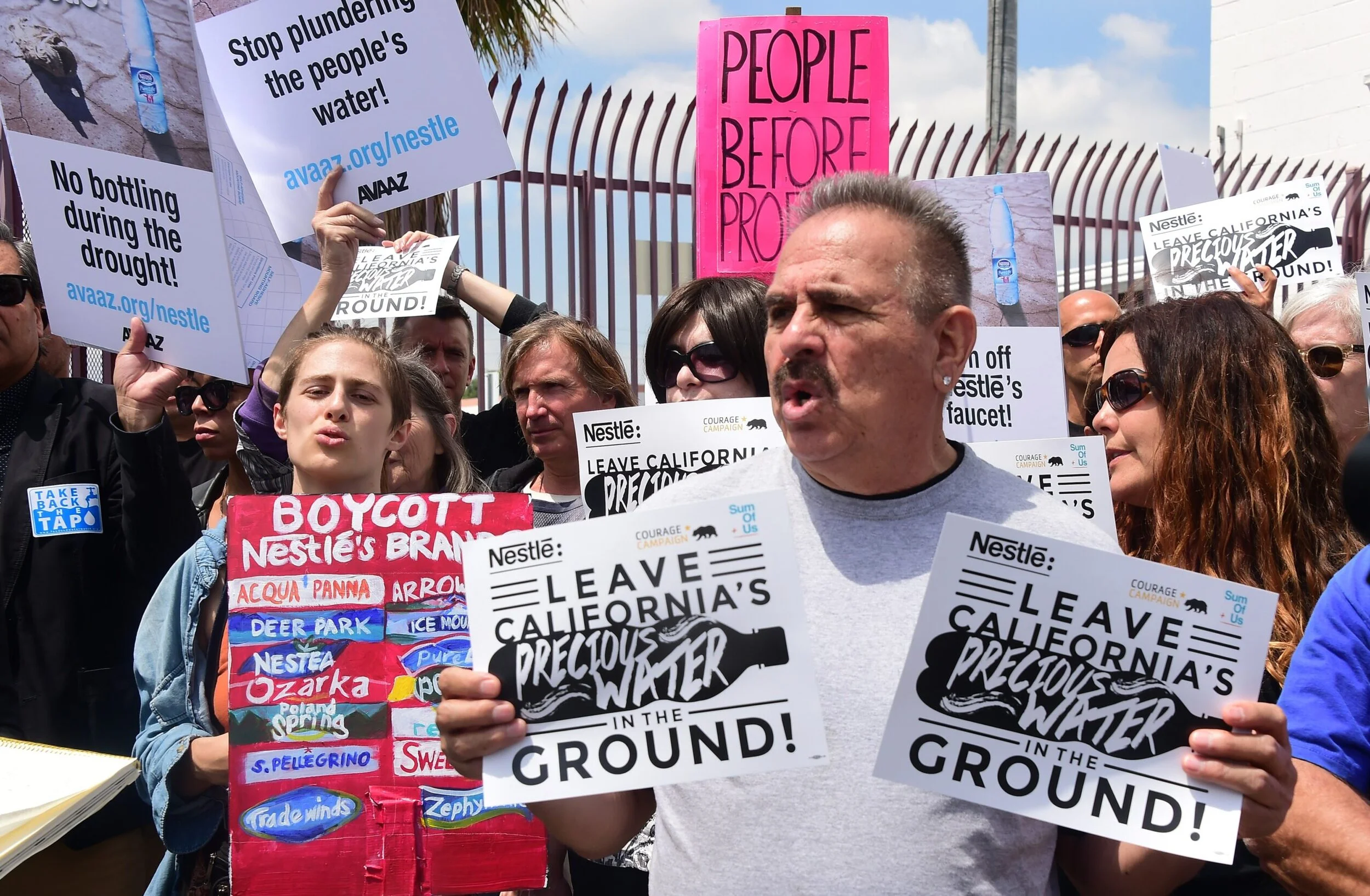 Activists protest outside a Nestlé water-bottling plant where they demanded that the company halt its water-bottling operations in response to the state’s drought in Los Angeles, California in May 2015. A simultaneous rally was held at a plant in Sacramento amid California’s fourth year of drought. (Photo by FREDERIC J. BROWN/AFP via Getty Images)