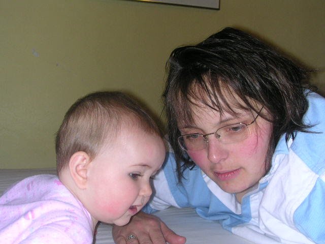 Mother and baby looking at the same thing intently