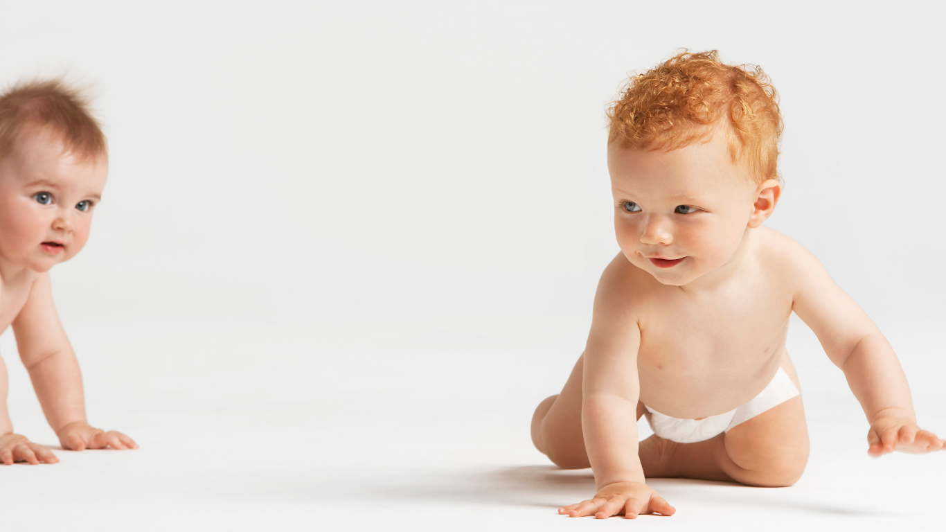 two babies crawling