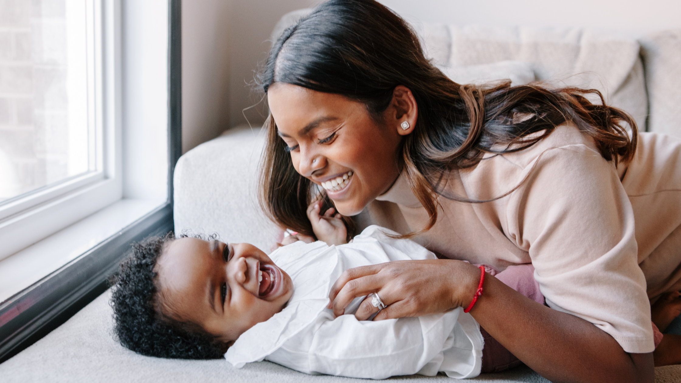Mum and baby laughing
