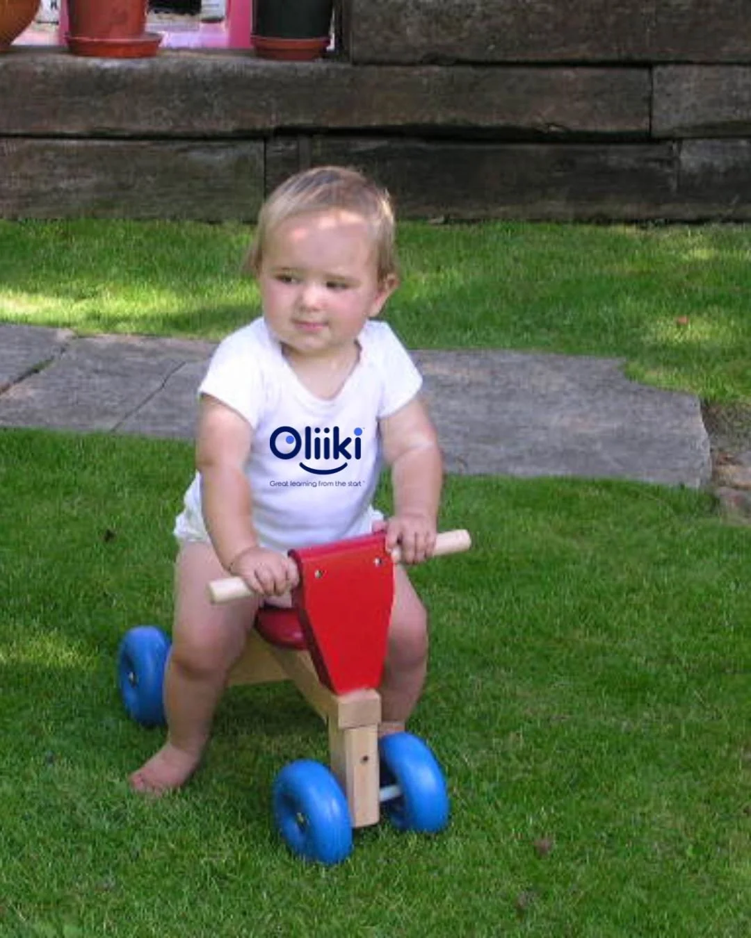 Baby on small ride on bike