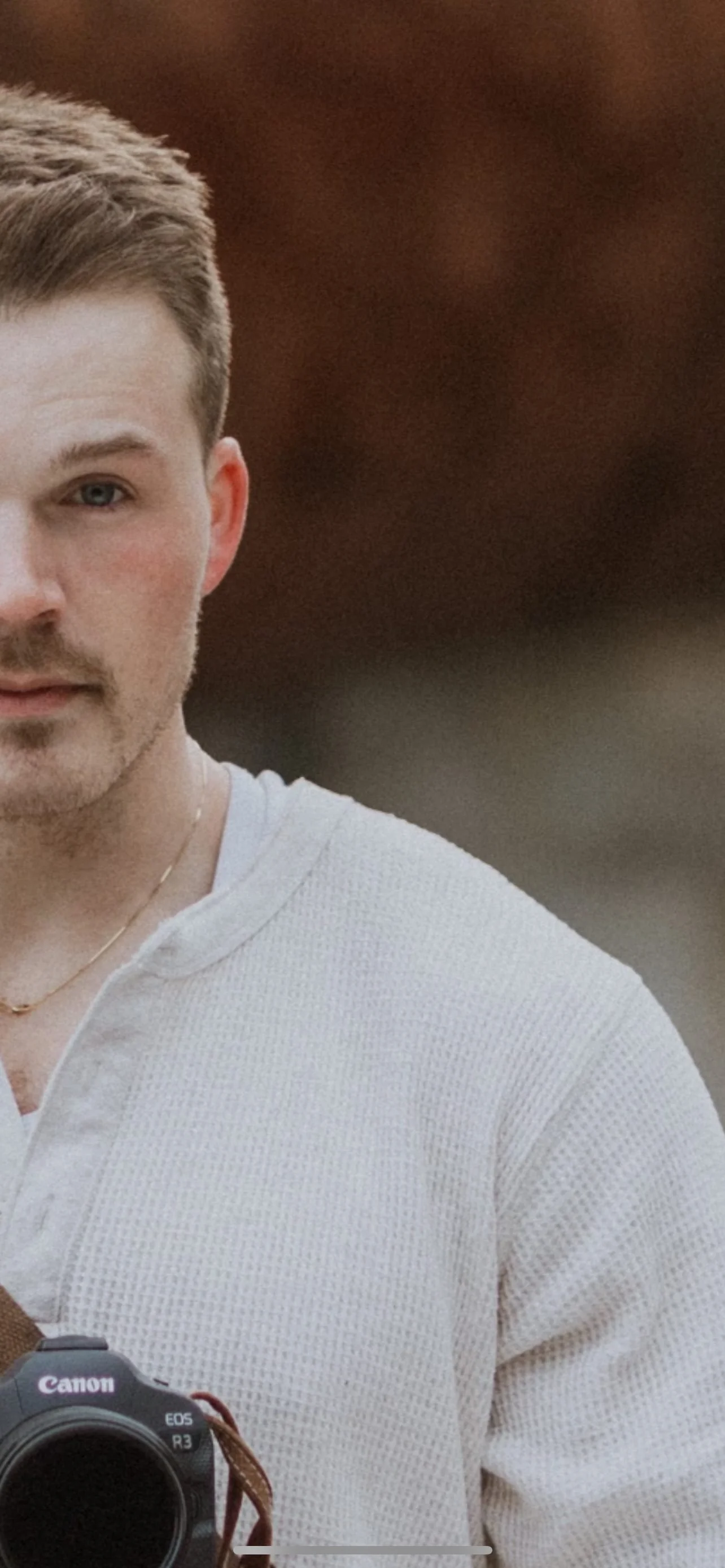 Close portrait of Brady Huxter with his camera