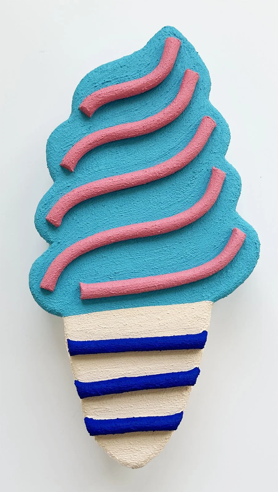 Close-up of light aqua and beige ice cream sculpture wall art by Steph Blondet, playful dessert-inspired artwork