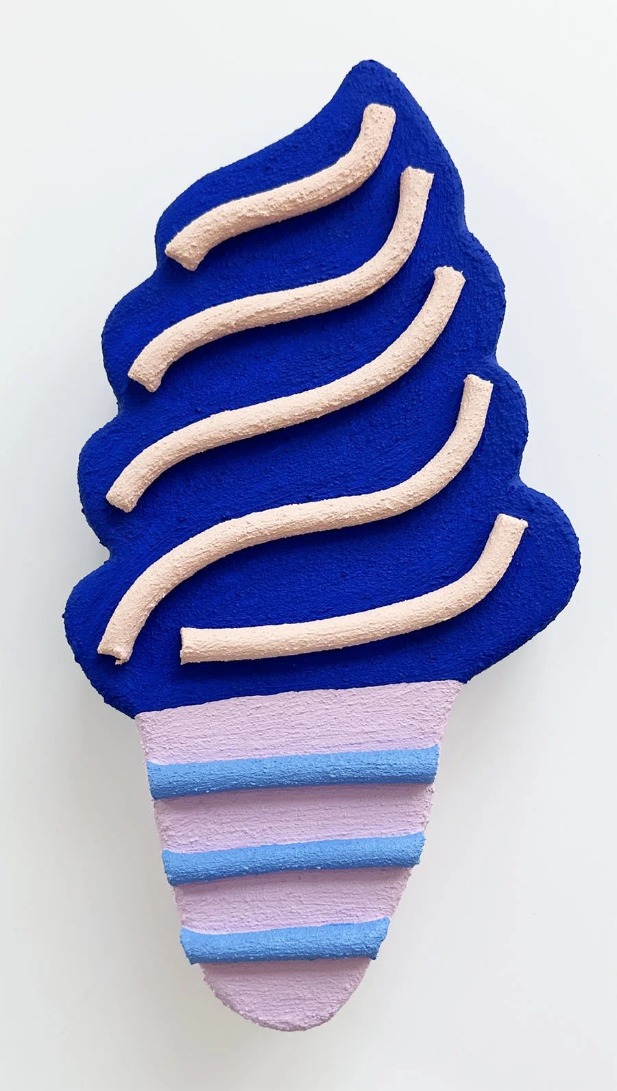 Close-up of blue and lilac ice cream sculpture wall art by Steph Blondet, playful dessert-inspired artwork