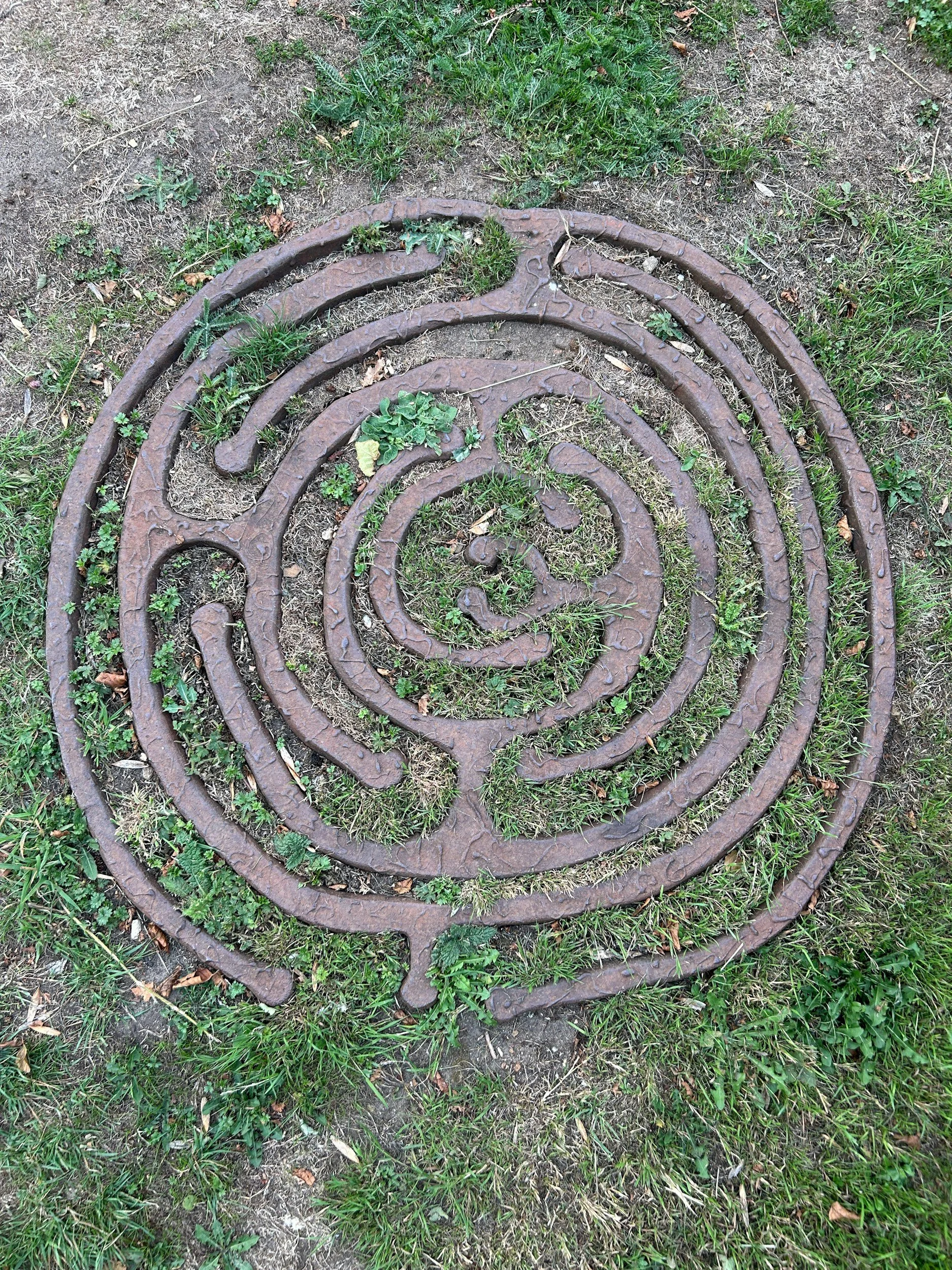 Geometric drawing of an outline square with sections divided by vertical, horizontal, and half circle lines.