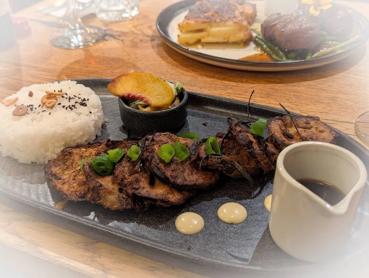 Restaurant main dish of slices aubergine with ponzu sauce