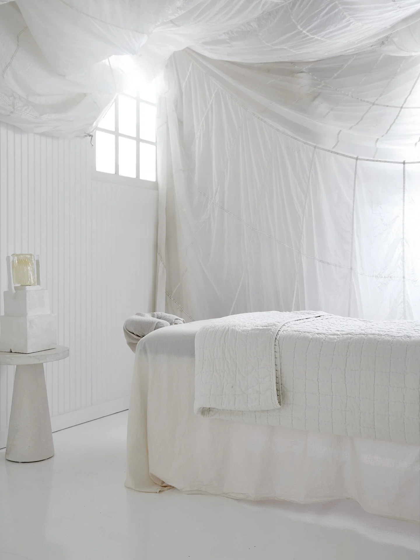 A little before-during-after moment for your feed today (well&hellip; in reverse, but you get it haha).

I found this retired French military parachute and used it to hide the pipes in our basement ceiling for this tiny massage zen den (how lucky are