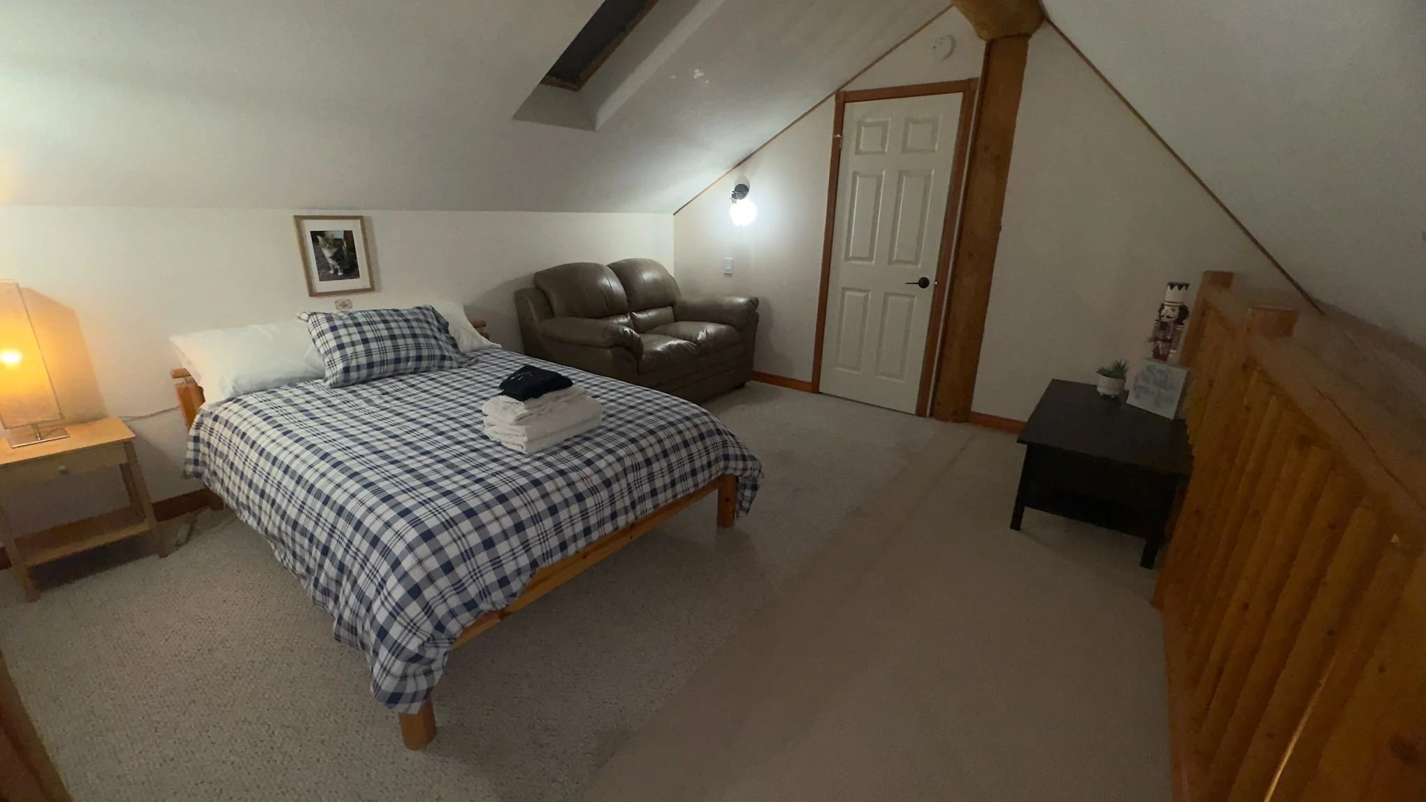 Open loft space, double bed and love seat