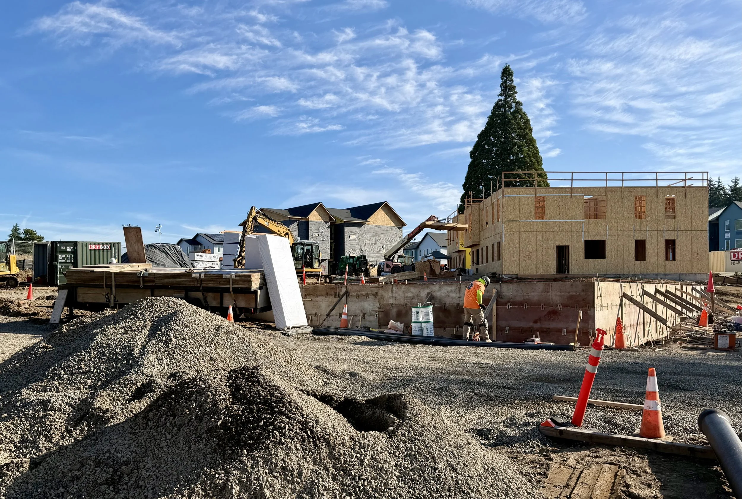 Concrete foundation forms set for a multifamily building in Salem, Oregon — foundation work underway ahead of framing