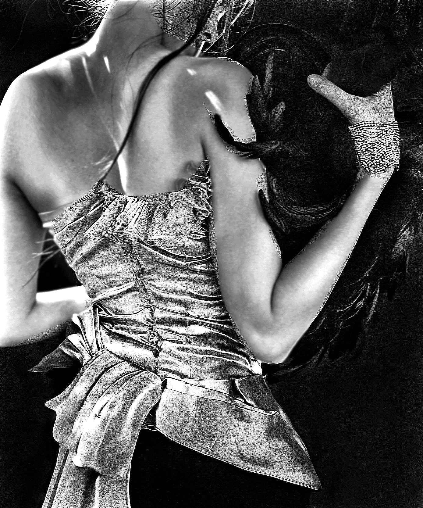 A woman lying down with her eyes closed, wearing a ruffled dress, with her head resting on her arm, and long dark hair spread around her.