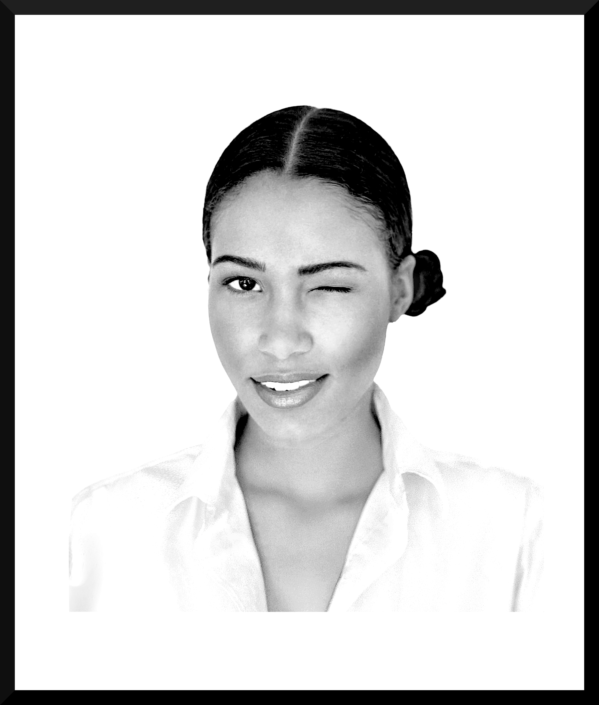 Black and white portrait of a woman smiling, one eye closed, wearing a collared shirt.