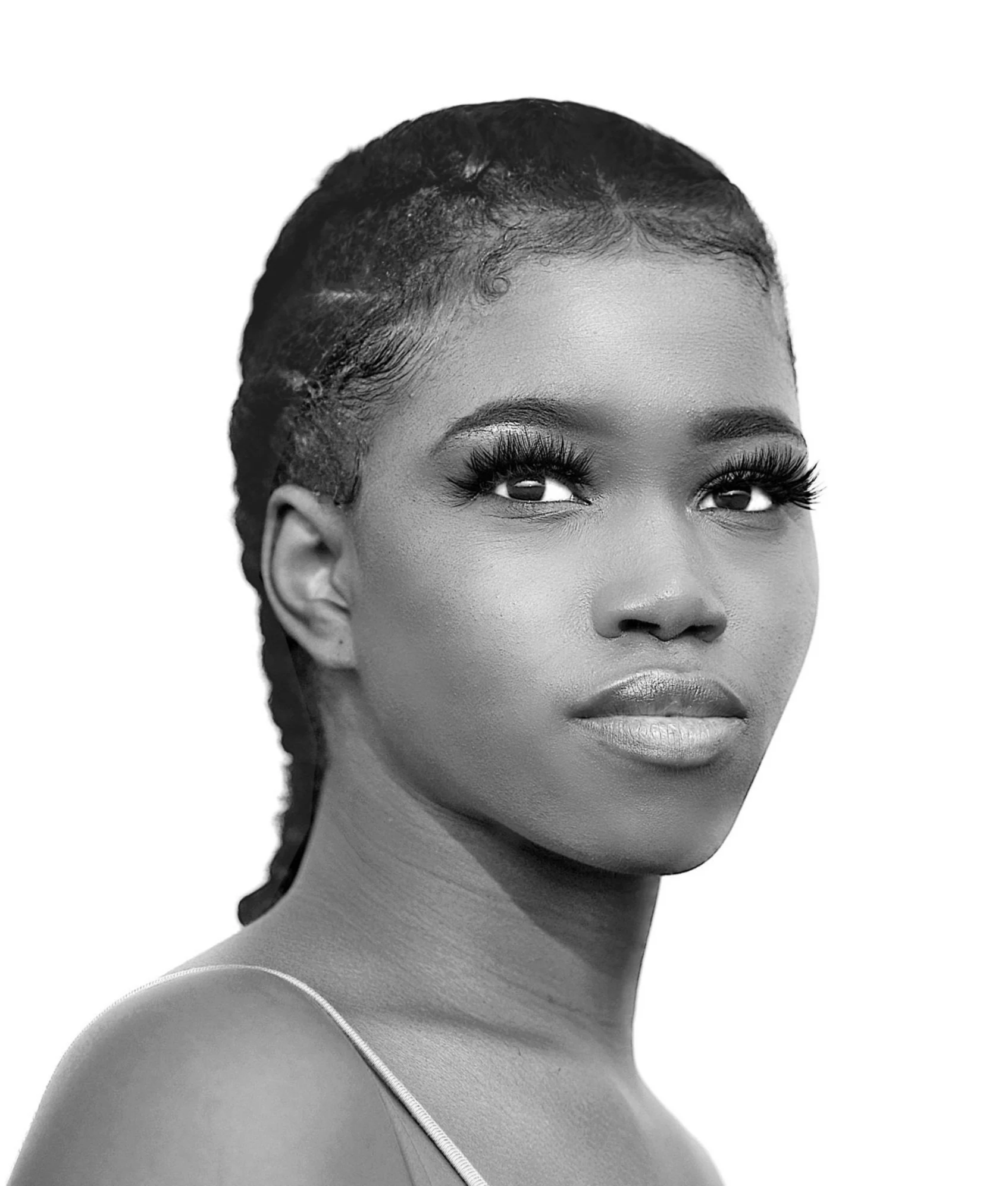 A black-and-white portrait of a young African-American woman with braided hair and dramatic eyelashes.
