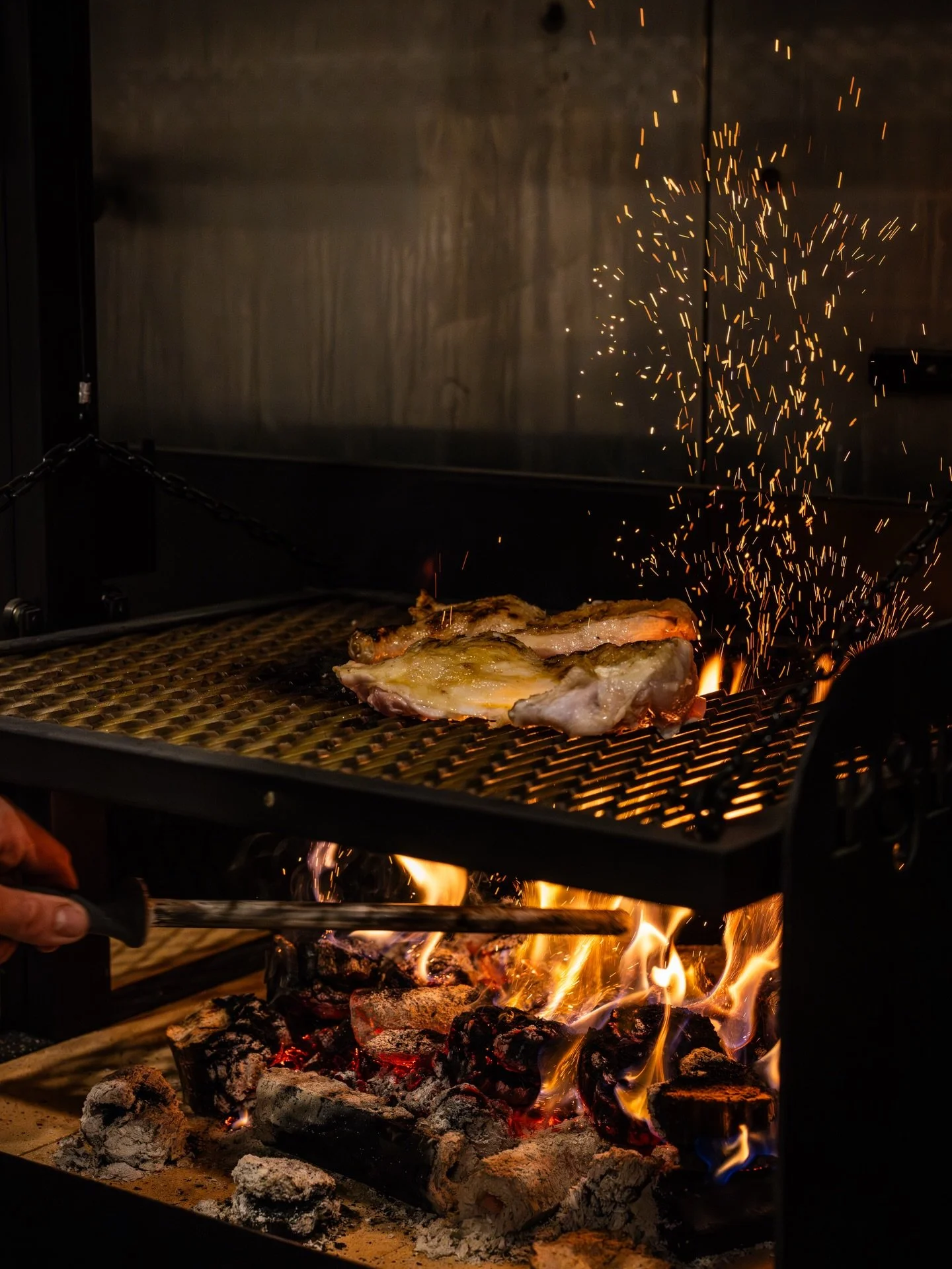 Sparks flying at @tuttibychillis with @cameron_cansdell on the parrilla. Capturing action through stills can be so powerful. 

Also flatbreads on the fire is life. 

#lovecentralcoast