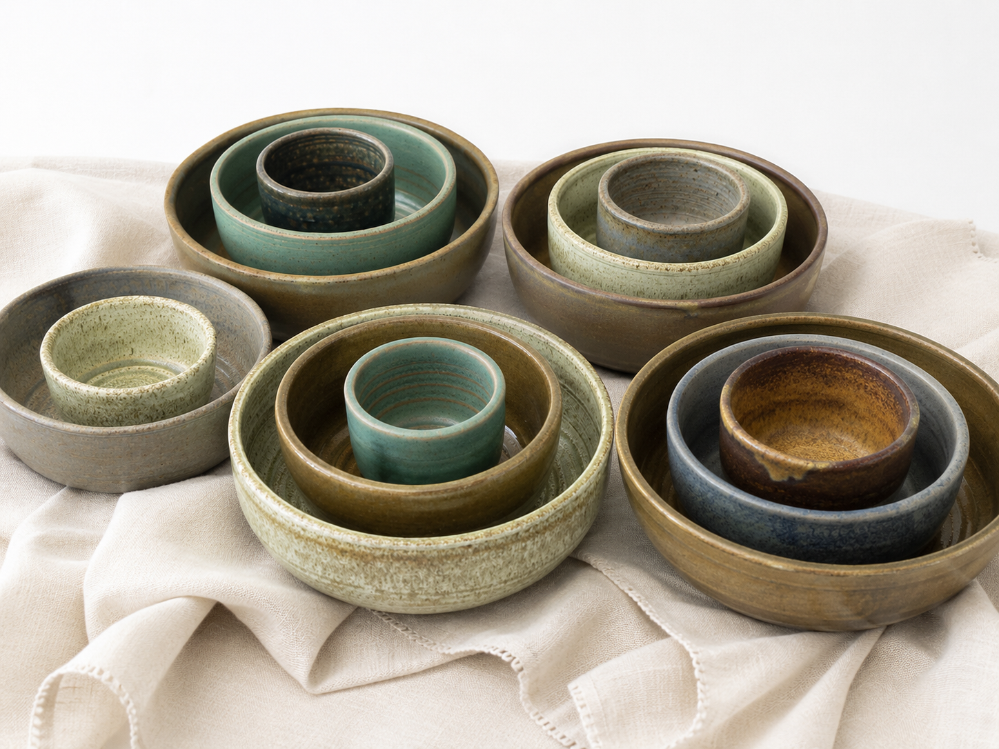 River Stone Collection featuring handmade stoneware bowls in five weathered matte glazes by Hayes Ceramics