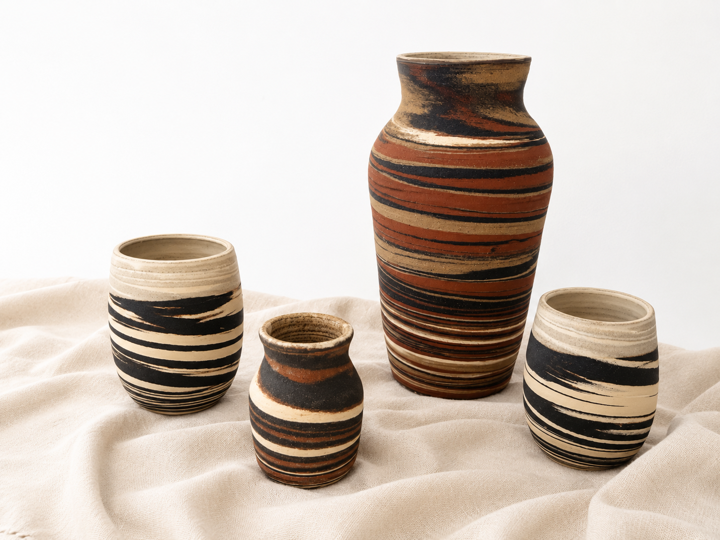 The Marbled Collection featuring handmade stoneware vessels with layered marbled clay patterns by Hayes Ceramics
