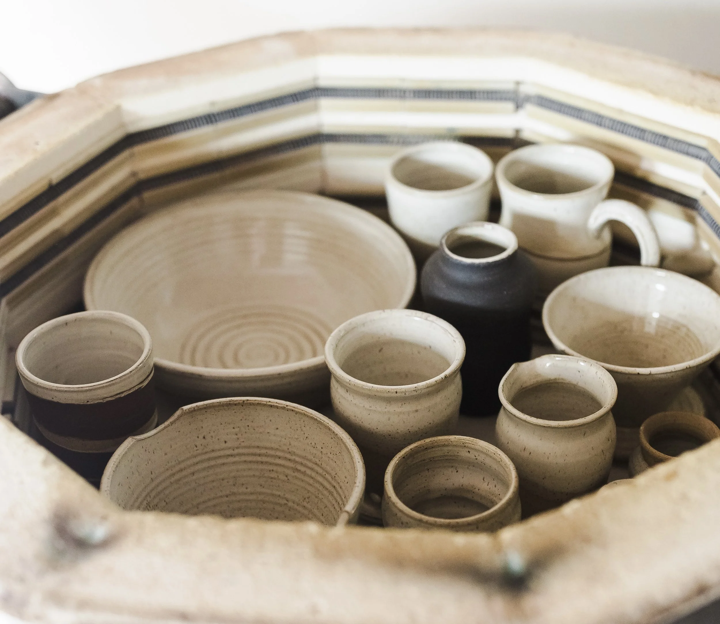 Freshly kiln-fired handmade stoneware bowls, mugs and serving pieces by Hayes Ceramics