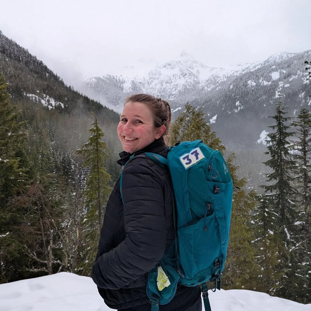 Nicole Beach, sex therapist in British Columbia, hiking in the snow on a mountain