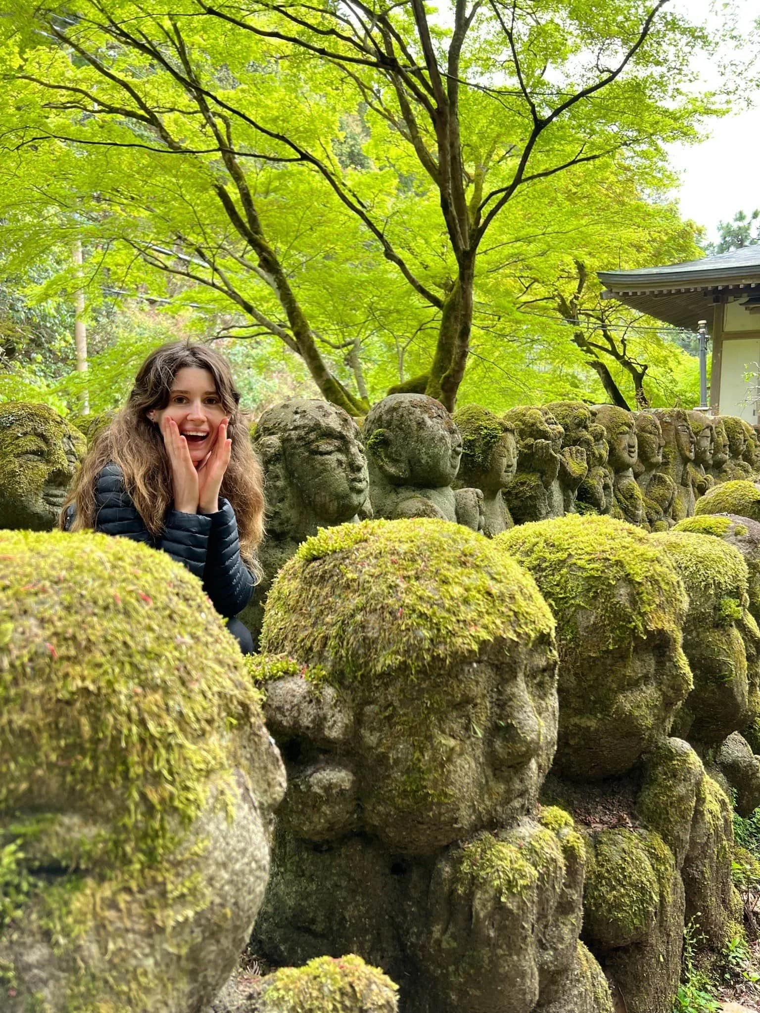 Andriana in Japan with statues
