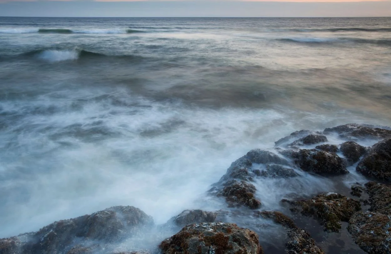 The water washing over the rocks in BC where Mareel offers relationship therapy in Vancouver