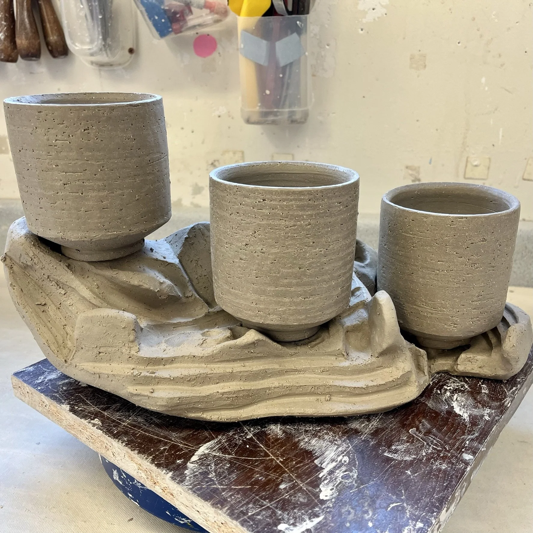 Carved side of cup and stand set