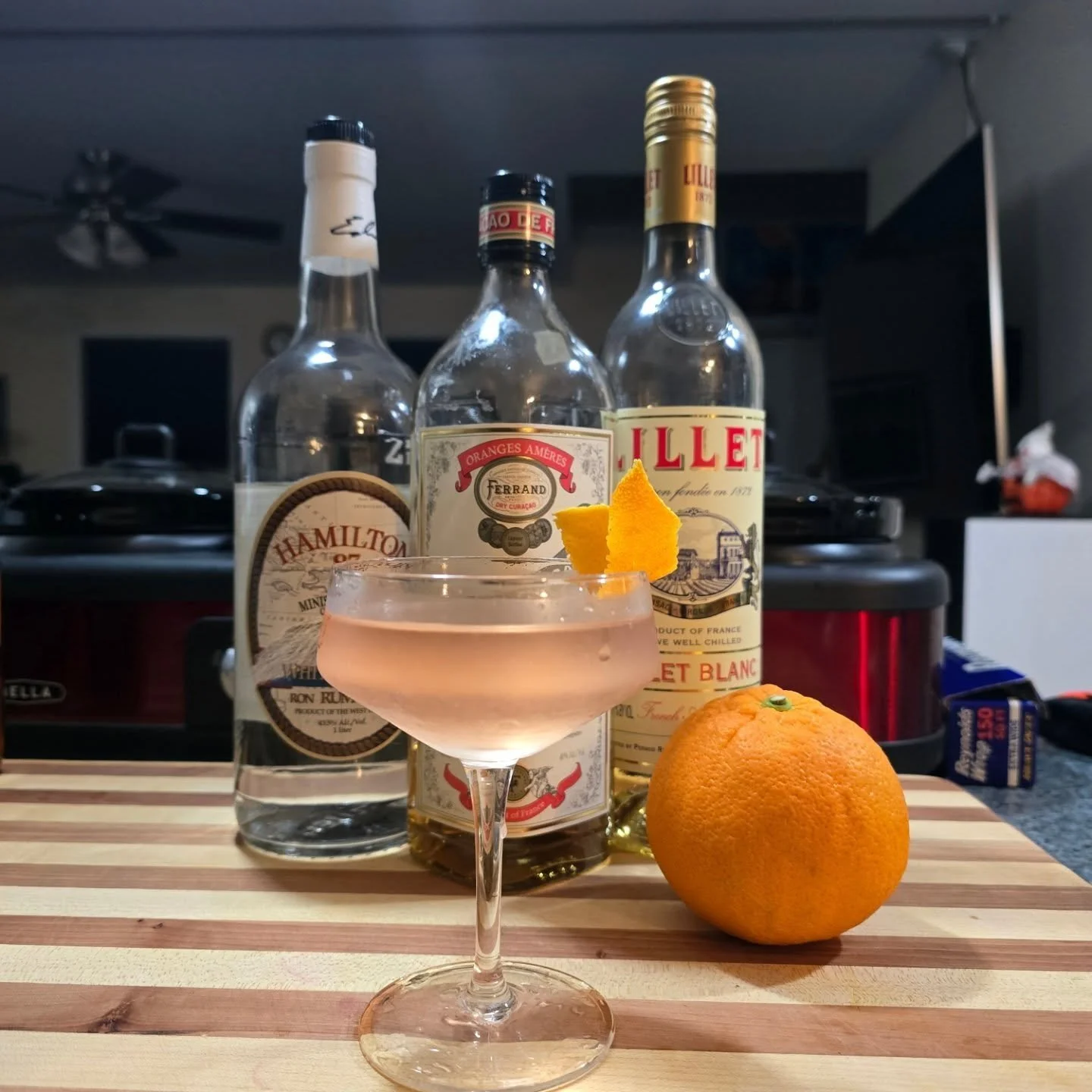 Elevated El Presidente

1.5 oz Hamilton 87 White Stache Rum
1.5 oz Lillet Blanc
.25 oz Ferrand Dry Cura&ccedil;ao 
1 bar spoon Grenadine

Stir with Cracked Ice until the glass is cold
Double Strain into a coupe or cocktails glass

Express the oils fr