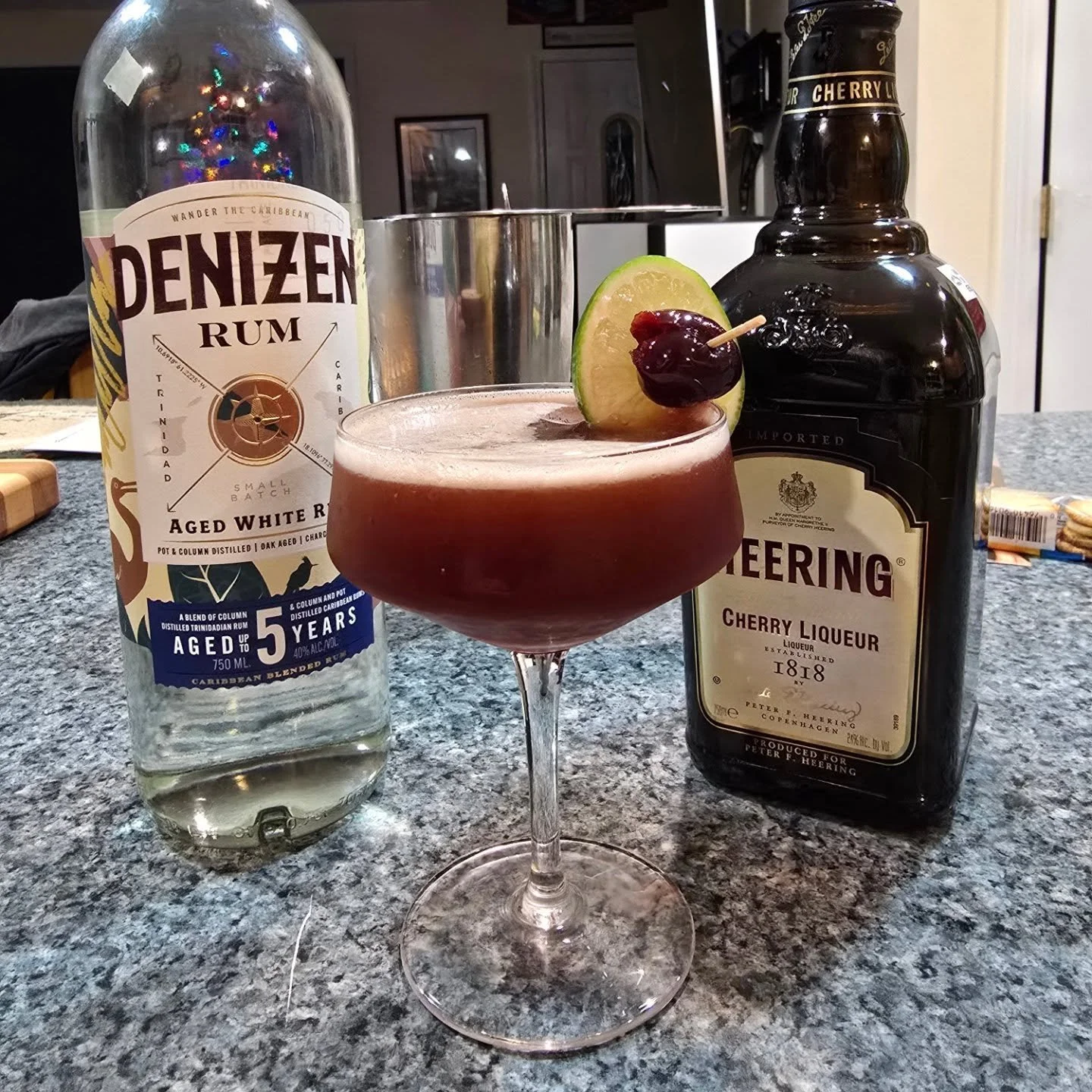 MERRY CHERRY DAIQUIRI 
2 oz Aged and Filtered [white] Spanish Style Rum [Puerto Rico, Blended, Trinidad]
1 oz fresh lime juice
3/4 oz Cherry Heering
1/2 oz Real Grenadine (Pomegranite) Syrup
1 barspoon Allspice/Pimento Dram
2 dashes Amgostura Bitters