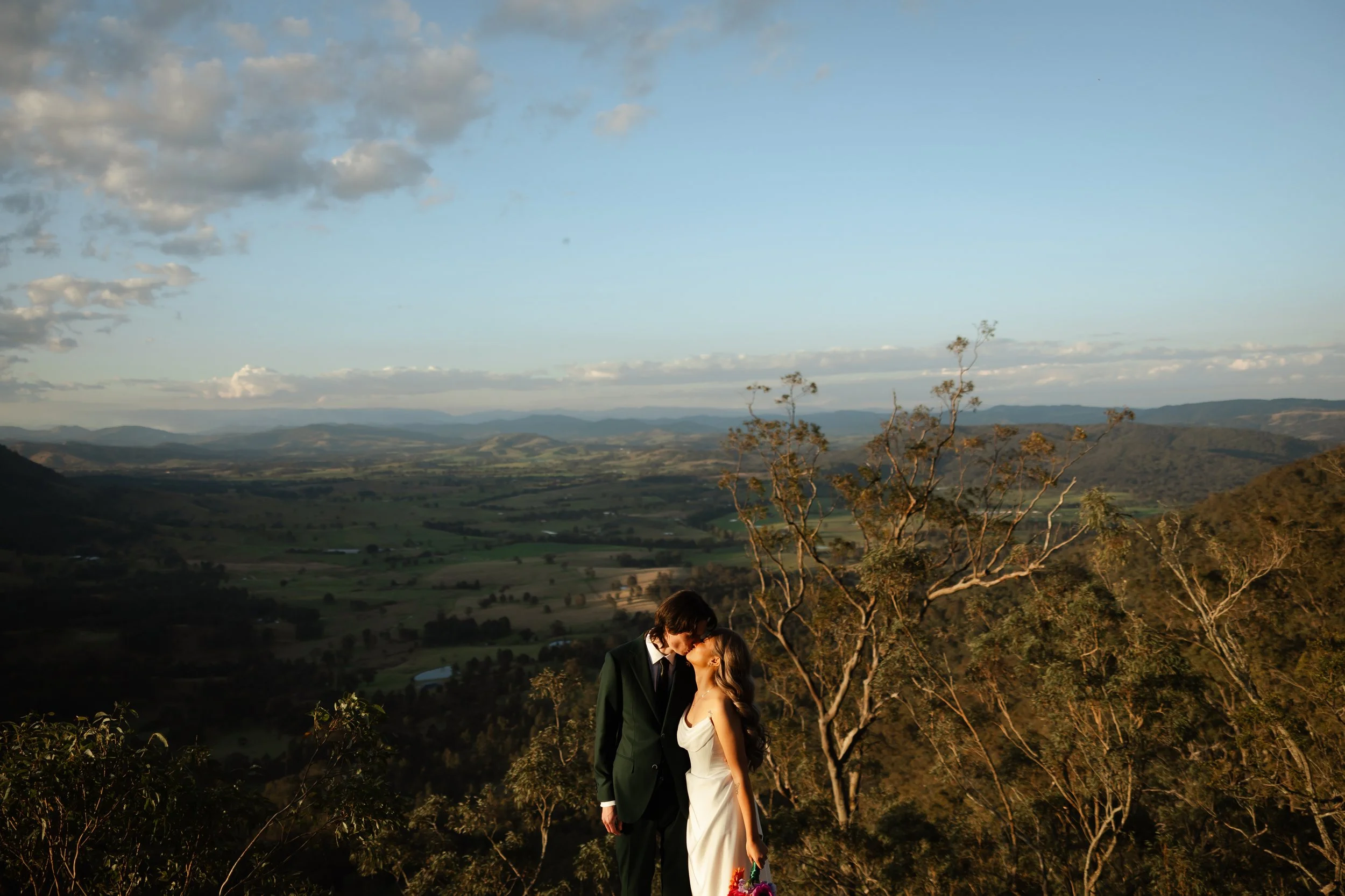epic wide shot of couple on top of mountain in australia