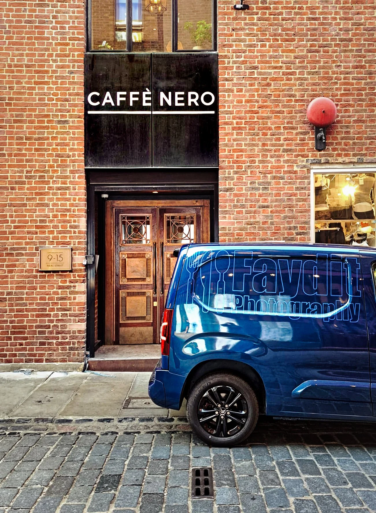 Faydit Photography’s branded van parked outside Caffè Nero on Neal Street in London, used to carry lighting, backgrounds and equipment for commercial food, drink and hospitality shoots.