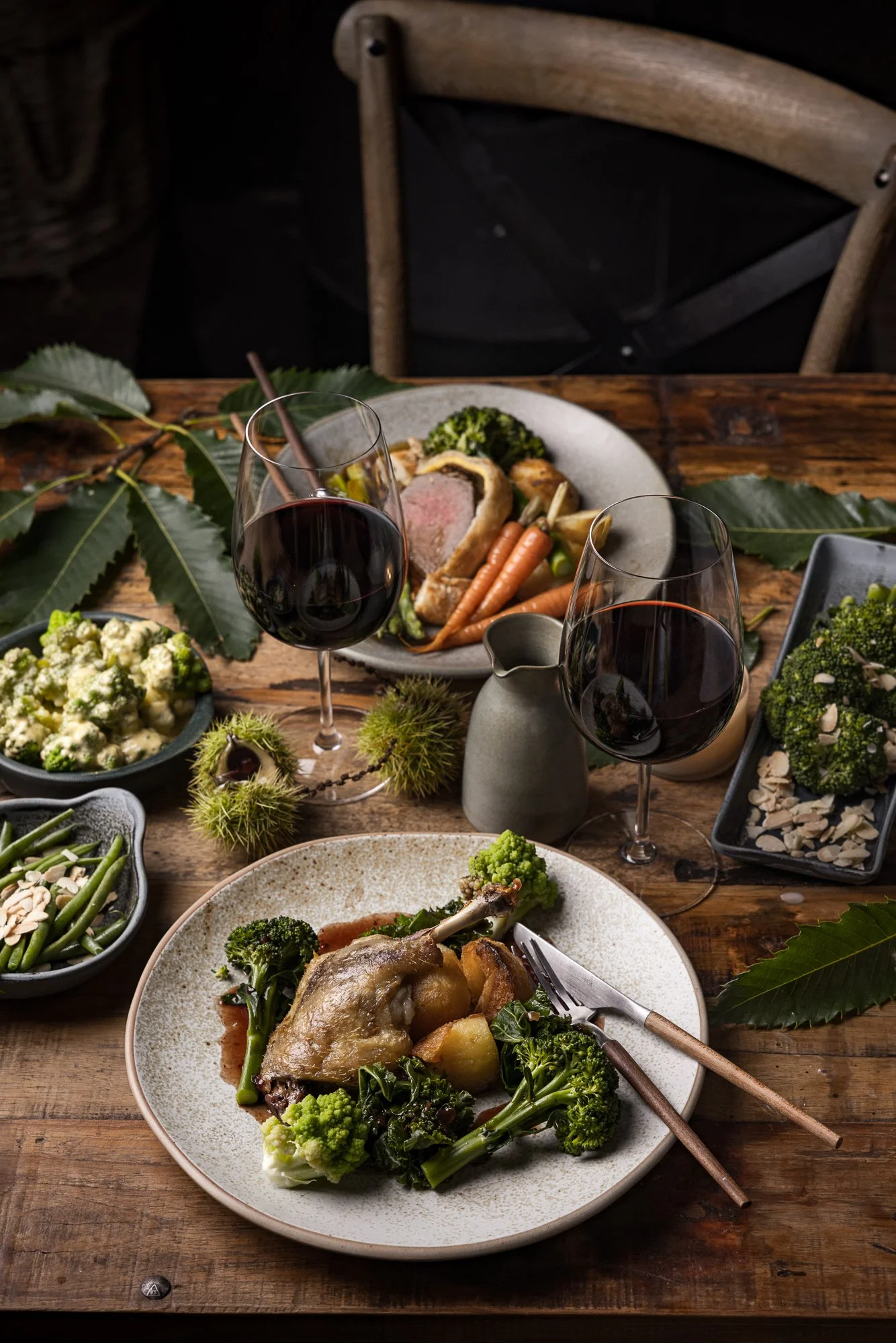 Duck confit served with potatoes, seasonal greens and accompanying dishes, photographed for Kenton Park Estate’s menus, website and wider hospitality marketing.