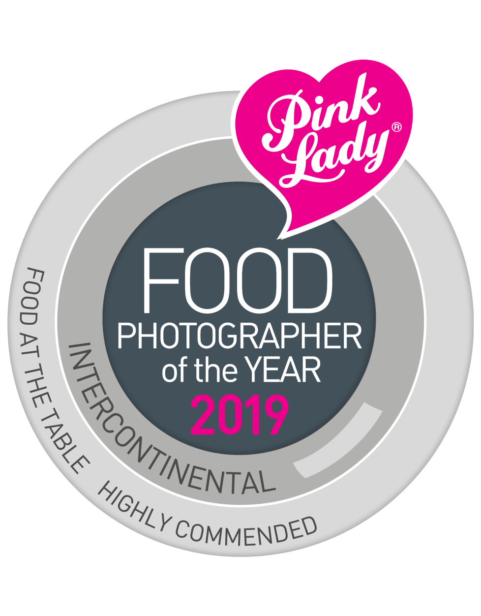 Award badge for Pink Lady Food Photographer of the Year 2019, INTERCONTINENTAL, highly recommended, food at the table.