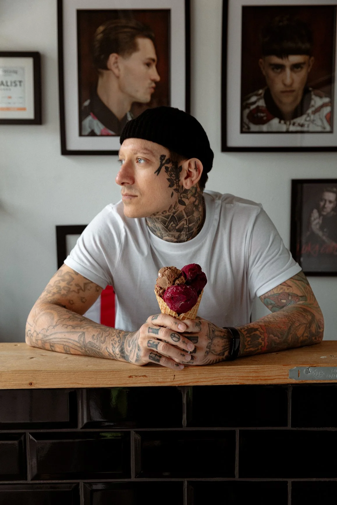Portrait of an ice cream maker holding a raspberry ice cream cone at Granny Gothards in Devon, created for commercial food, people and brand photography.