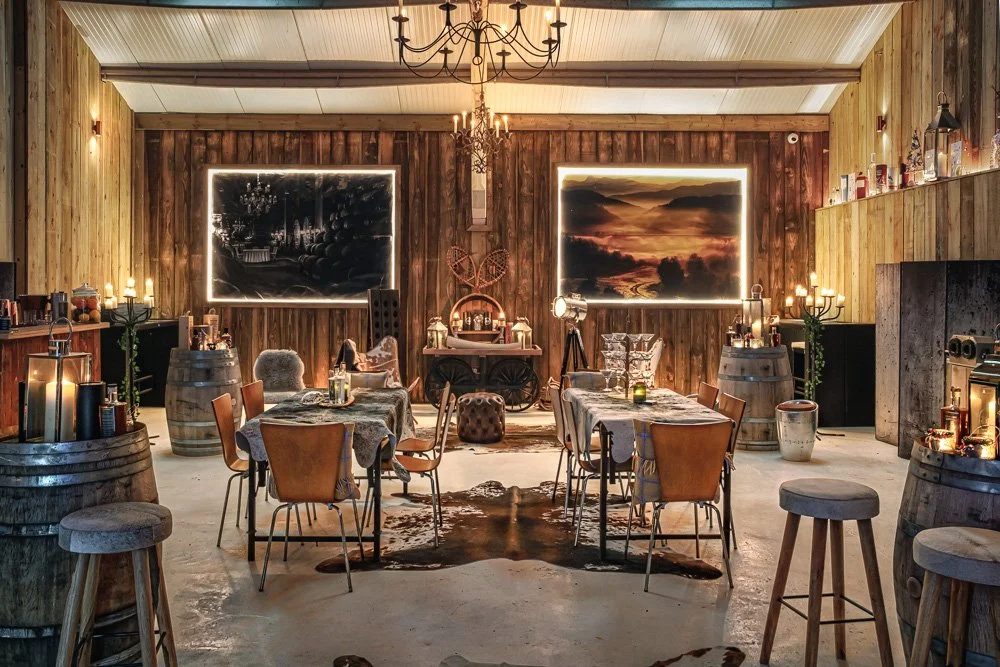 Warm timber-lined hospitality interior at Kenton Park Estate & Vineyard, with laid tables and bar seating, photographed near Exeter for venue and event promotion.