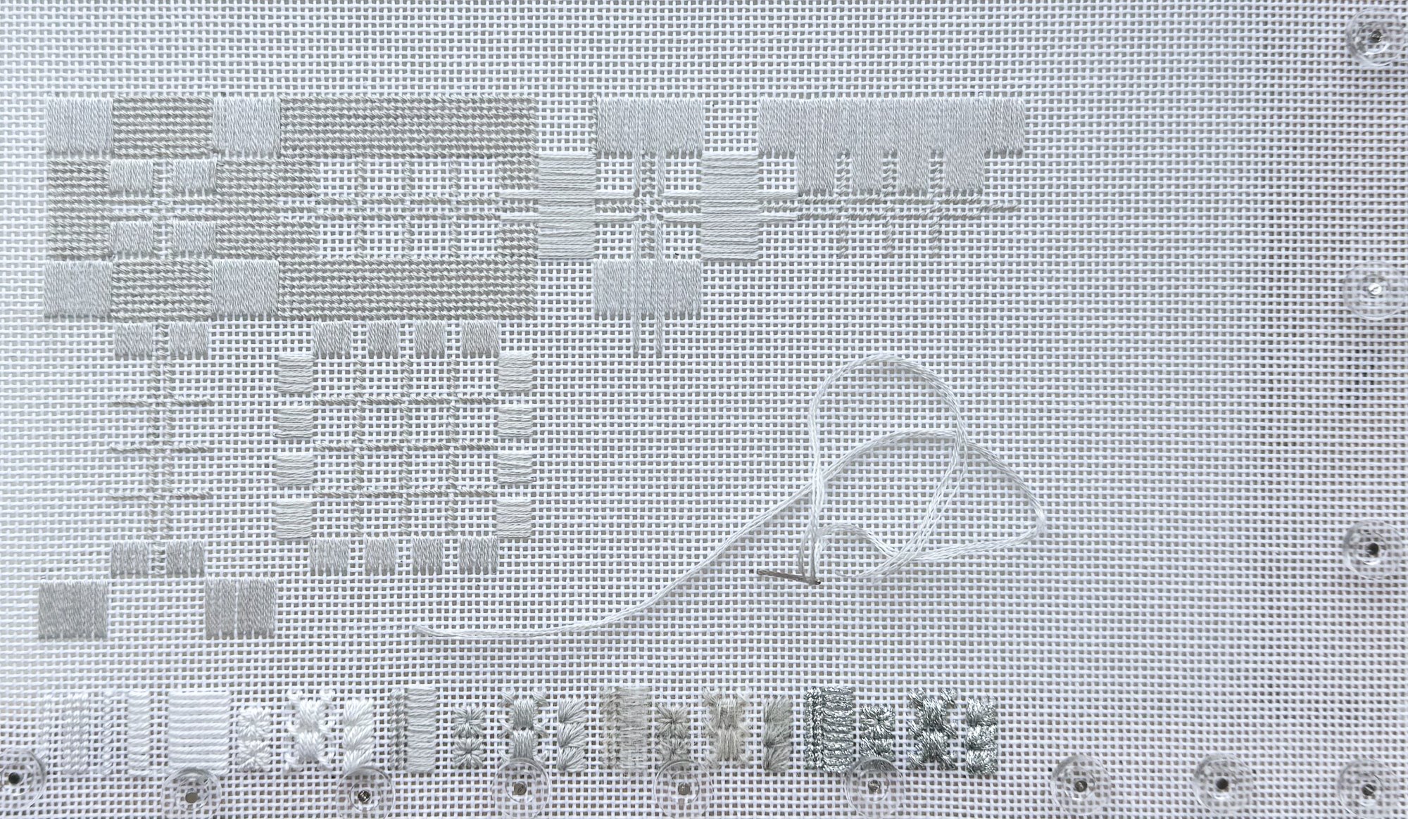 Drellis, bet izšūts